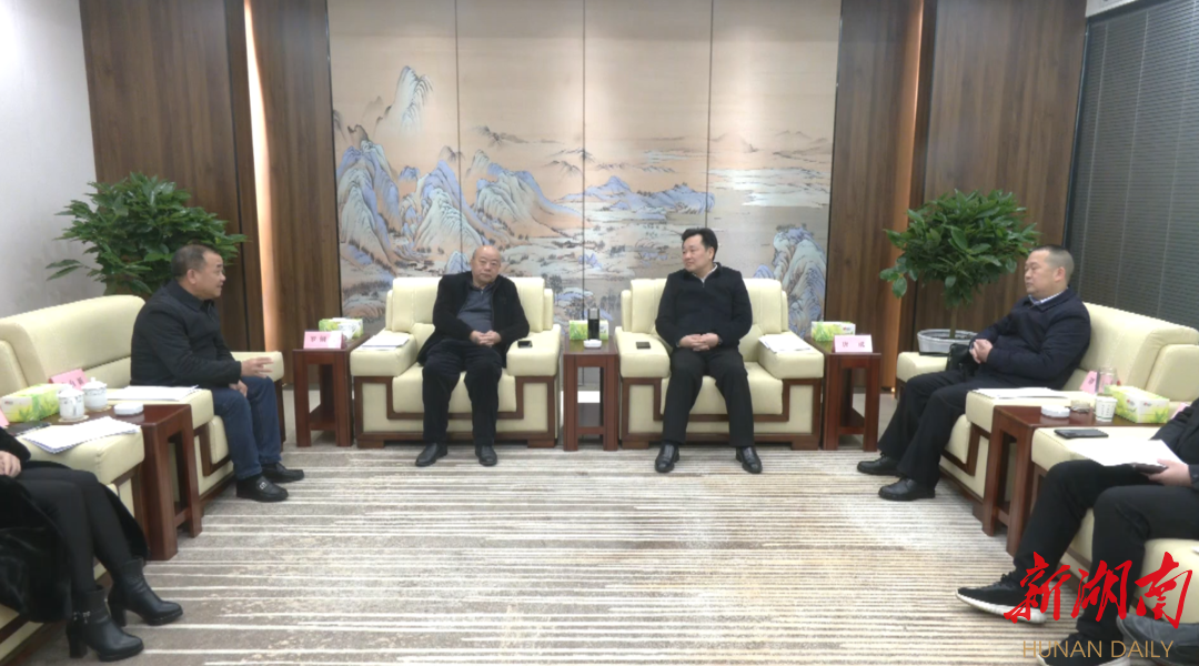 唐成会见罗俐勇一行