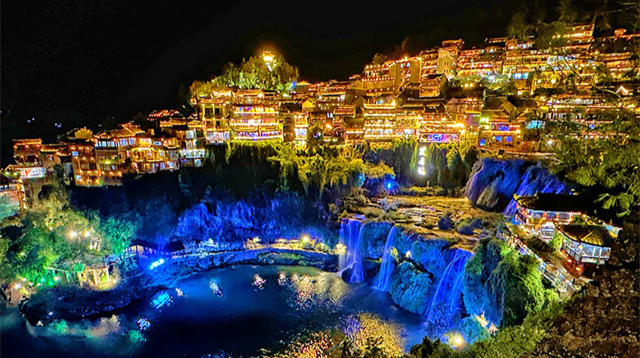 People Enjoy Night Tours in Furong Ancient Town