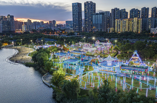 People Enjoy Coolness at Beach Amusement Park