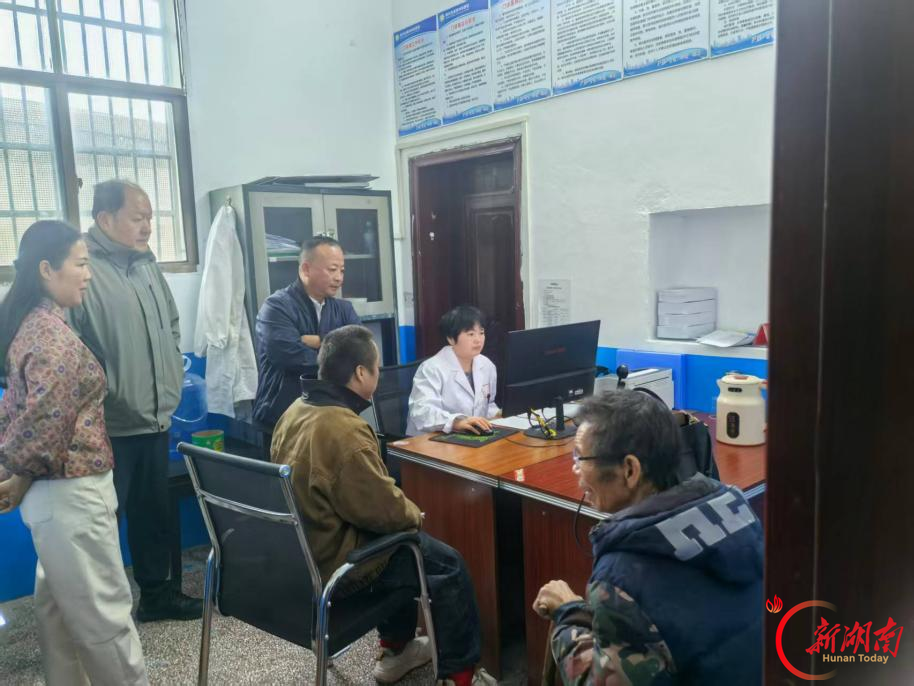 江南工业集团驻村工作队倾力帮办残疾证 解民忧暖民心